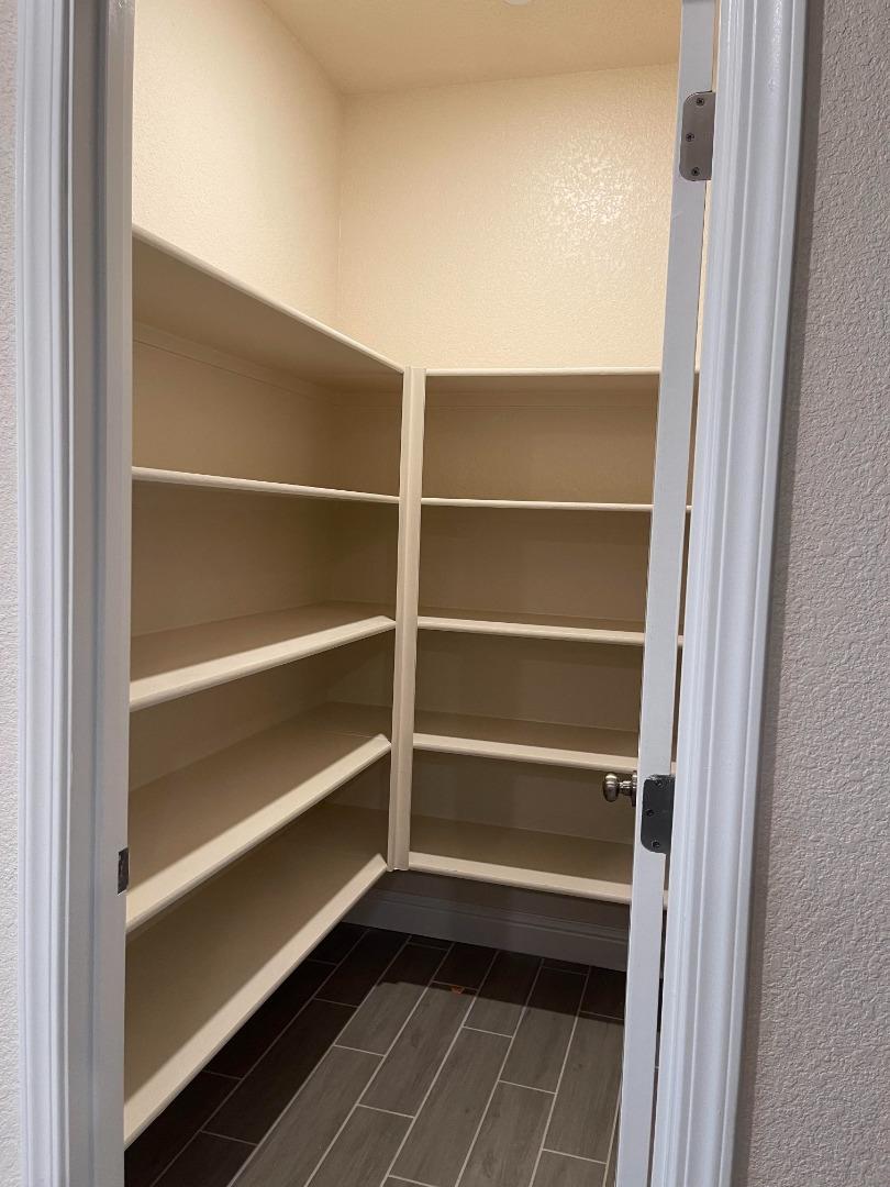 2411 Gabriel Drive Merced, CA 95340 - Photo 10 of 22 a view of walk in closet with empty racks