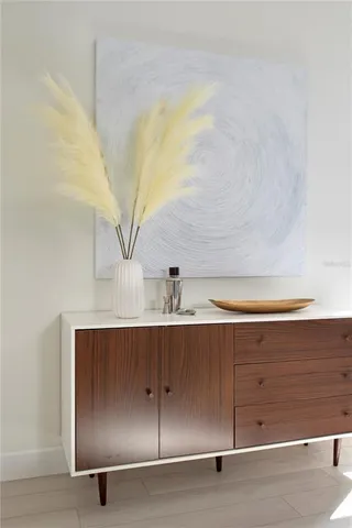 a kitchen with stainless steel appliances kitchen island granite countertop a table and chairs in it