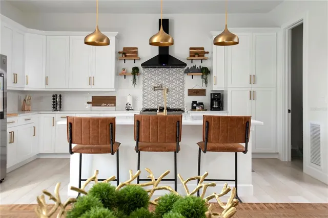 a kitchen with a stove and cabinets