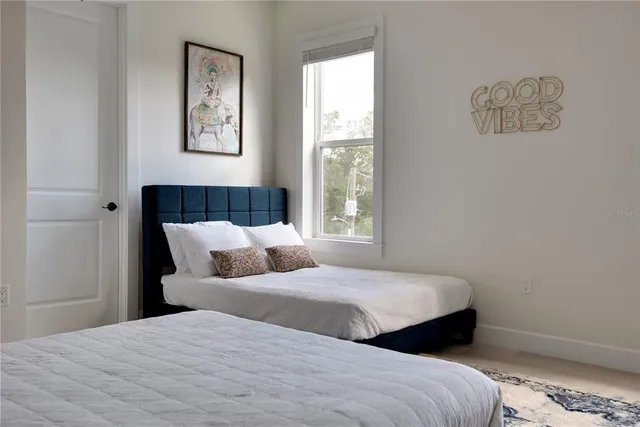 a bedroom with a bed and a couch