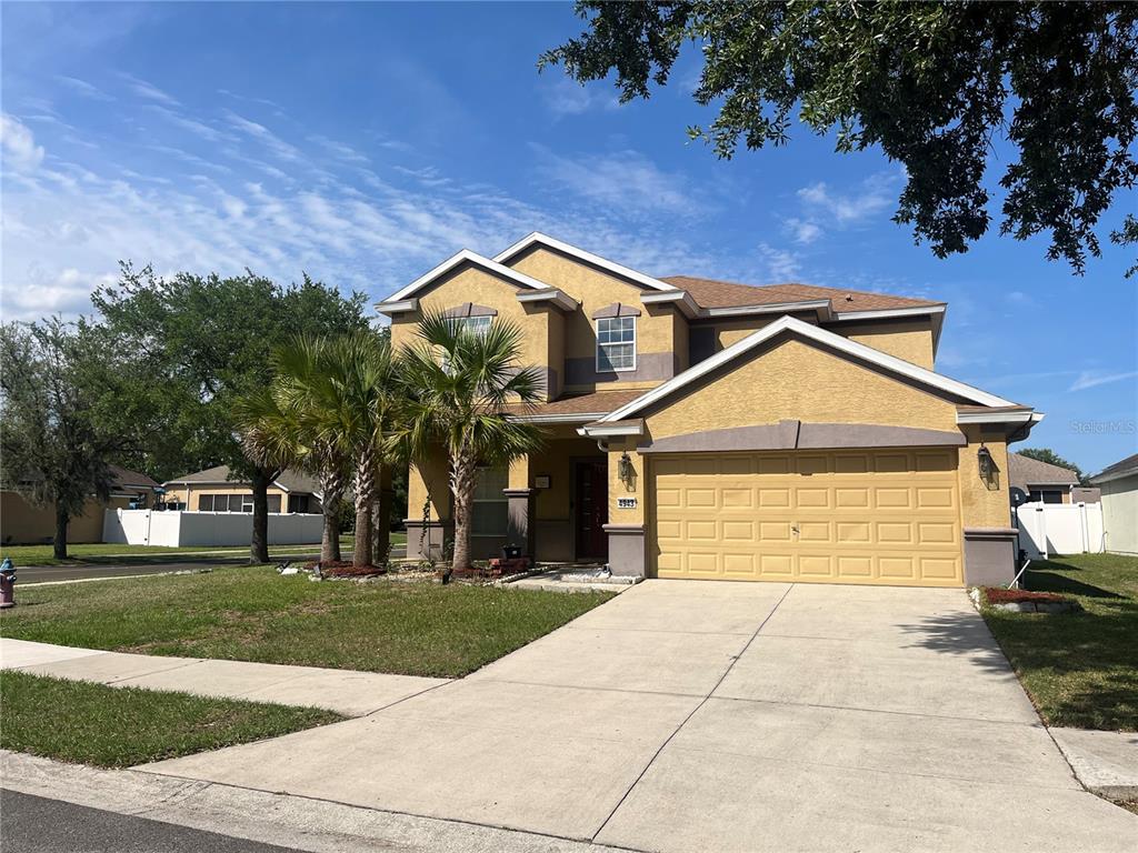4943 Southwest 41st Place Ocala, FL 34474 - Photo 1 of 30 a front view of a house with garden