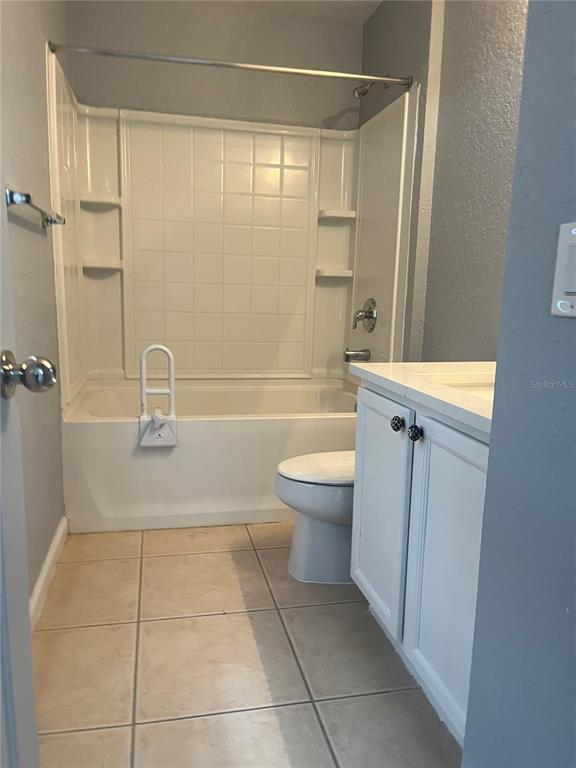 4943 Southwest 41st Place Ocala, FL 34474 - Photo 26 of 30 a bathroom with a sink a toilet and shower