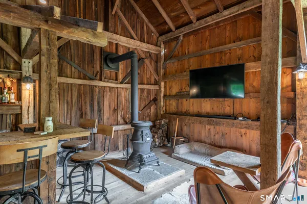a view of a patio with table and chairs with wooden floor
