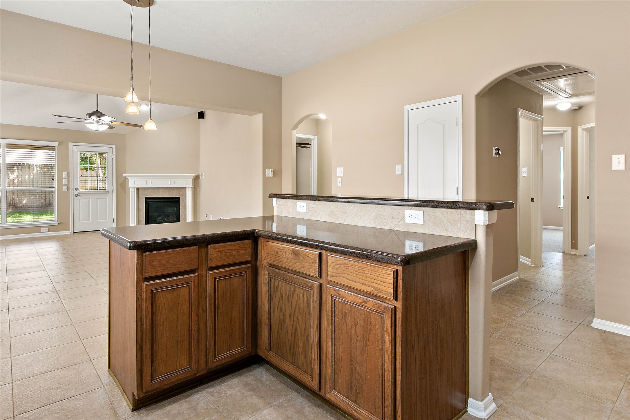 30411 Deleon Fields Drive Spring, TX 77386 - Photo 8 of 24 Integrated kitchen island provides extra counter space and a perfect gathering spot within the open layout.