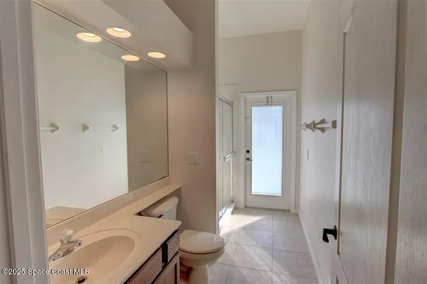 a bathroom with a sink and mirror