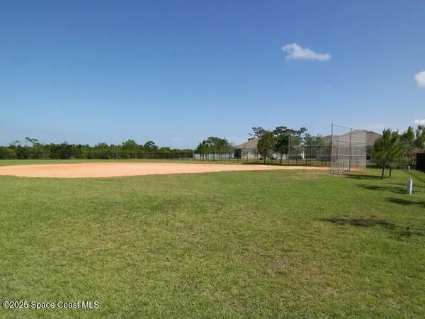a view of a lake with houses in the background