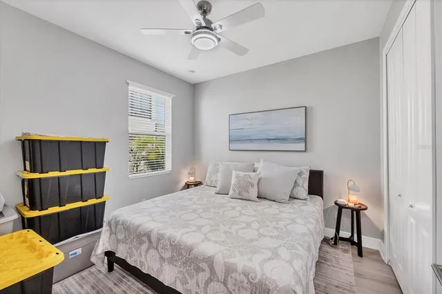 a bedroom with a bed and window