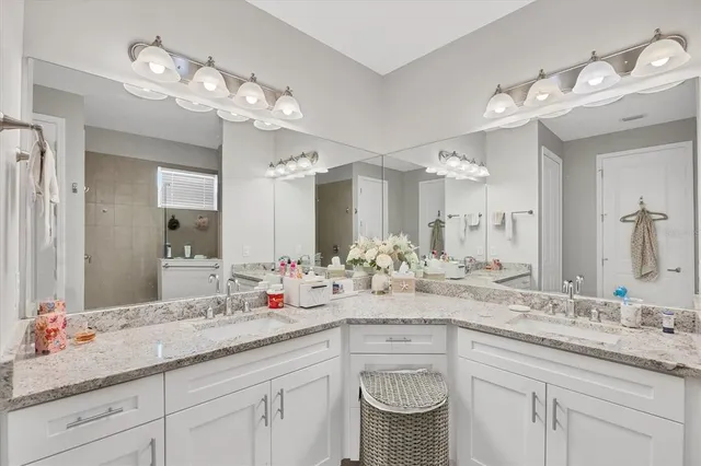 a bathroom with a sink a vanity and a mirror