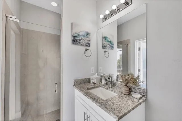 a living room with patio furniture and a large window