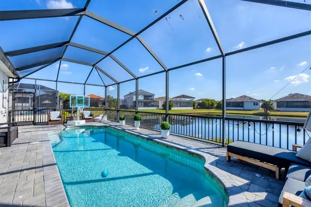 a view of a house with swimming pool and garden