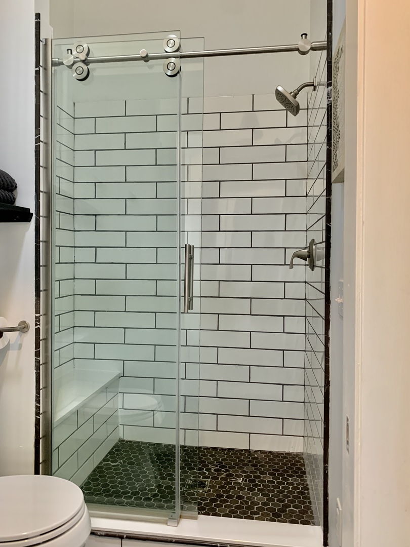 1386 Meadows Road Geneva, IL 60134 - Photo 34 of 50 a bathroom with a shower and toilet