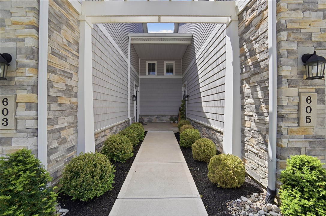 605 Cape Cod Court Beavercreek, OH 45430 - Photo 5 of 54 This inviting entrance features modern architecture and thoughtful landscaping.