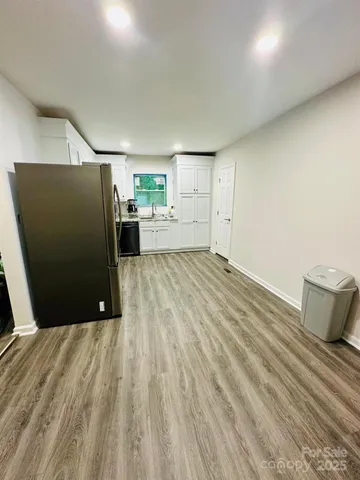 a view of a hardwood floor in a room