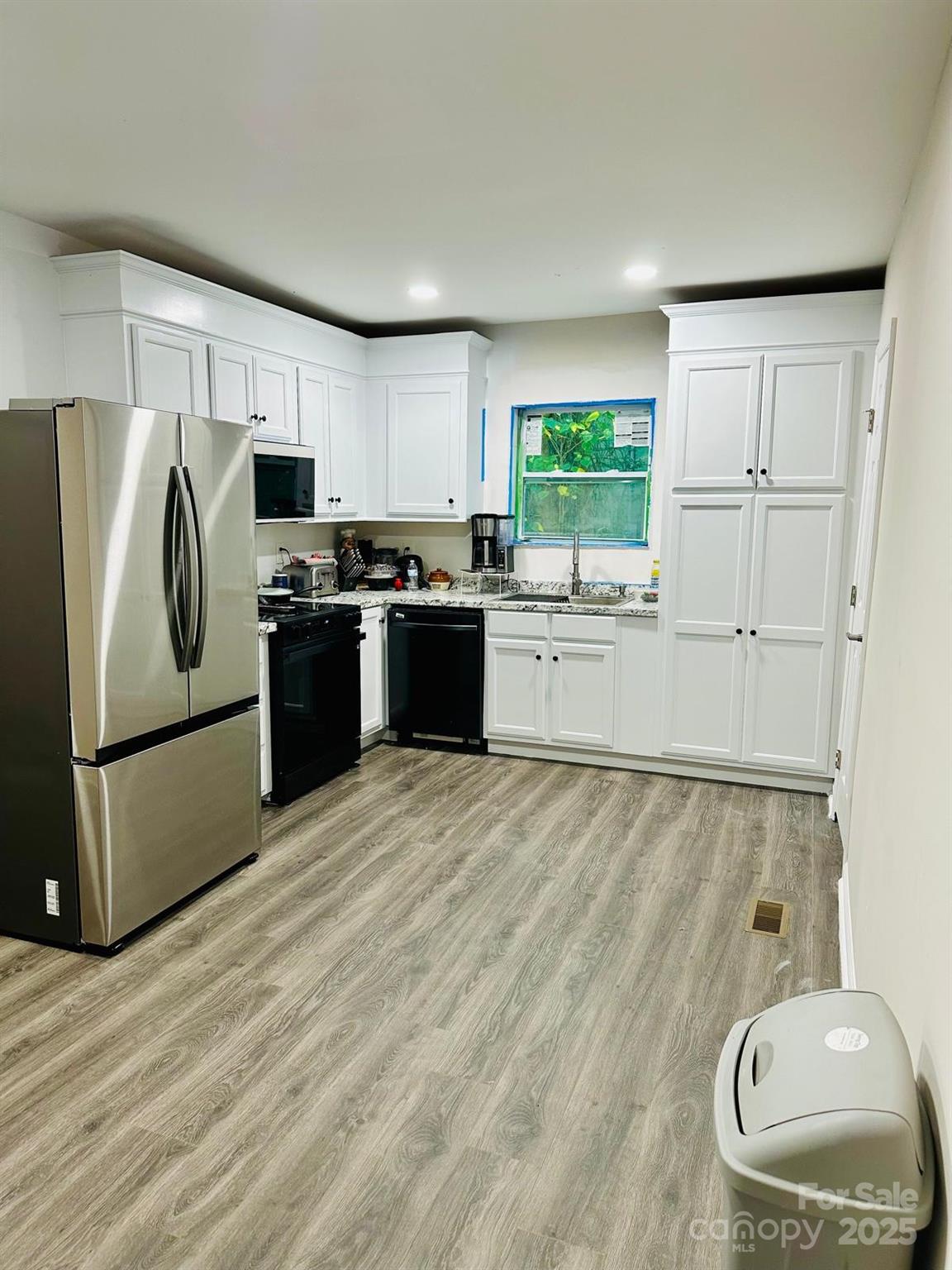 1010 13th Street, Unit 11 Lancaster, SC 29720 - Photo 12 of 22 a kitchen with a refrigerator and a stove