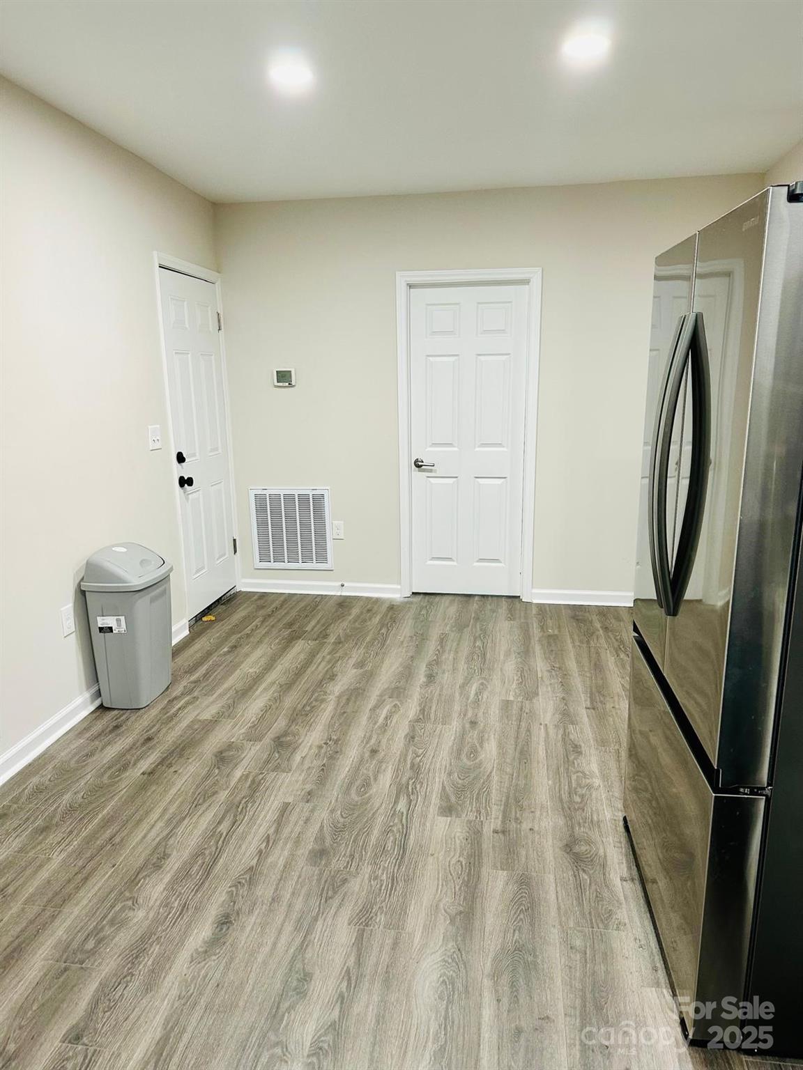 1010 13th Street, Unit 11 Lancaster, SC 29720 - Photo 13 of 22 a view of a room with wooden floor and staircase