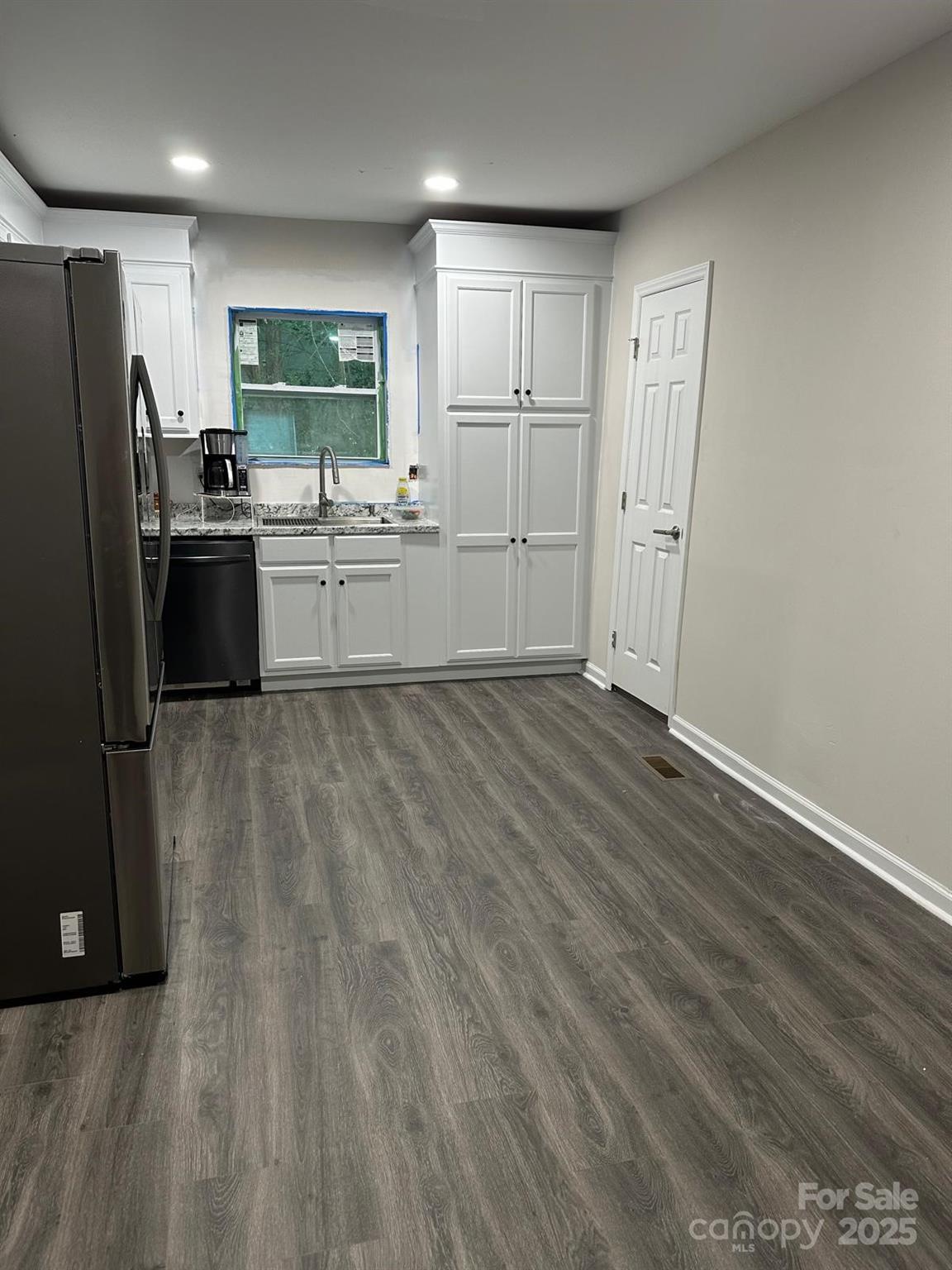 1010 13th Street, Unit 11 Lancaster, SC 29720 - Photo 14 of 22 a kitchen with a sink a refrigerator and cabinets