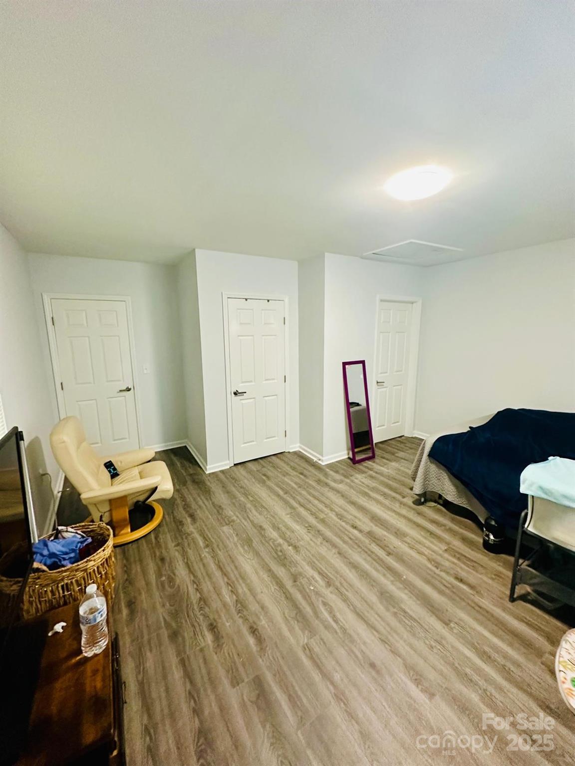 1010 13th Street, Unit 11 Lancaster, SC 29720 - Photo 8 of 22 a bed room with a bed and a chair