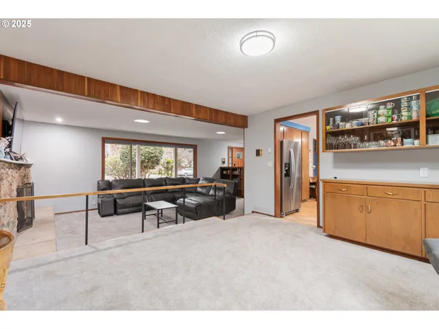 a kitchen with stainless steel appliances kitchen island granite countertop a sink and cabinets