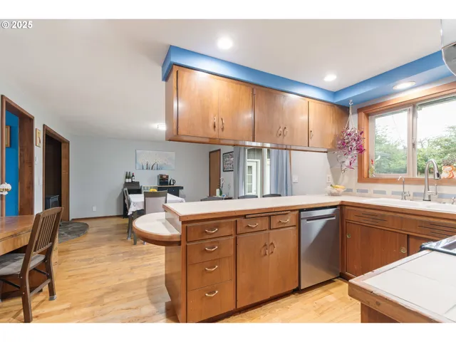 a dining room with a table and chairs