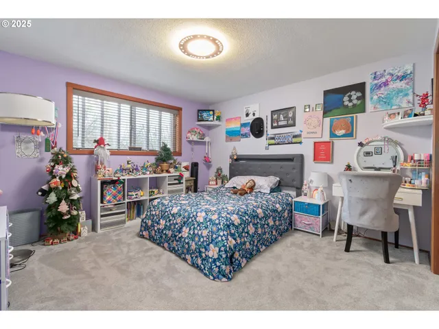 a living room with a flat screen tv and a fireplace