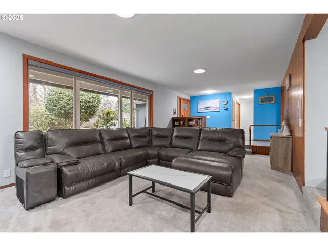 a living room with furniture and a table