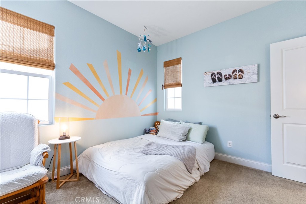 9354 Riberena Circle Atascadero, CA 93422 - Photo 27 of 47 a bedroom with a bed and wooden floor