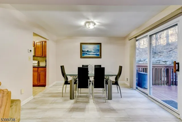 a view of a dining room with furniture and window