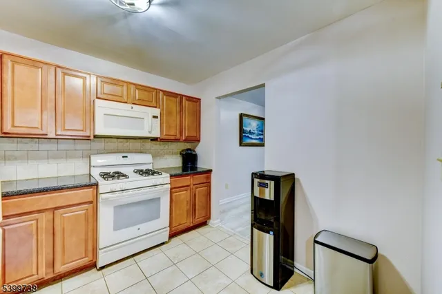 a kitchen with a stove top oven and sink