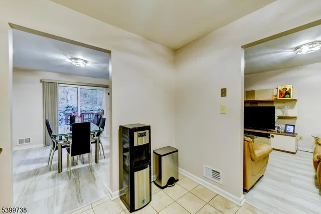 a view of a livingroom with furniture window and wooden floor