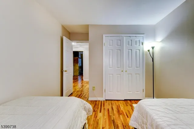 a bedroom with a bed and a closet