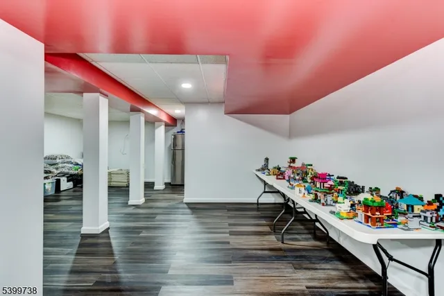 a hallway with wooden floor and toys