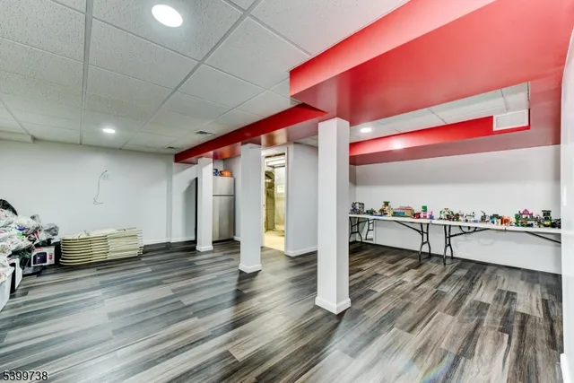 a view of a living room with a table and chairs