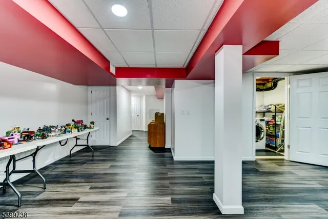 a room with lots of furniture and wooden floor