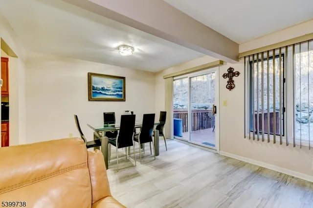 a view of a dining room with furniture and window