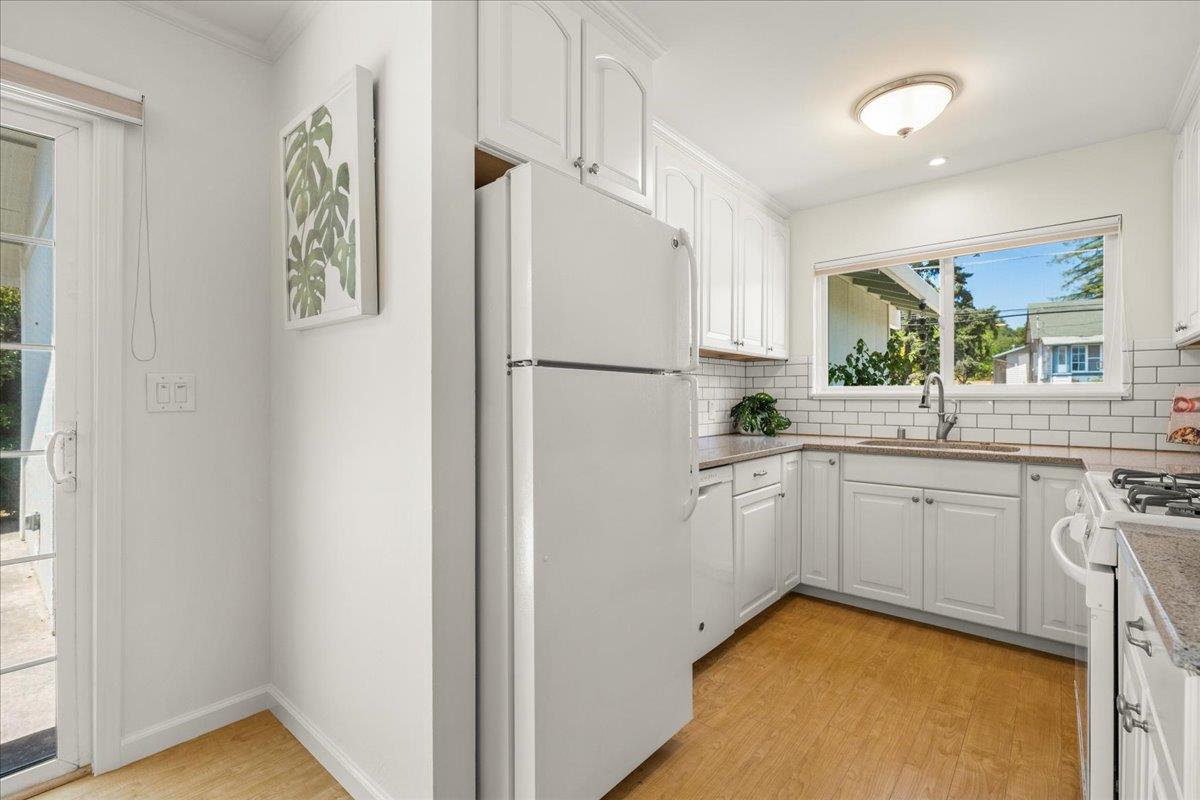 115 Hames Road Watsonville, CA 95076 - Photo 13 of 32 a white refrigerator freezer sitting inside of a kitchen