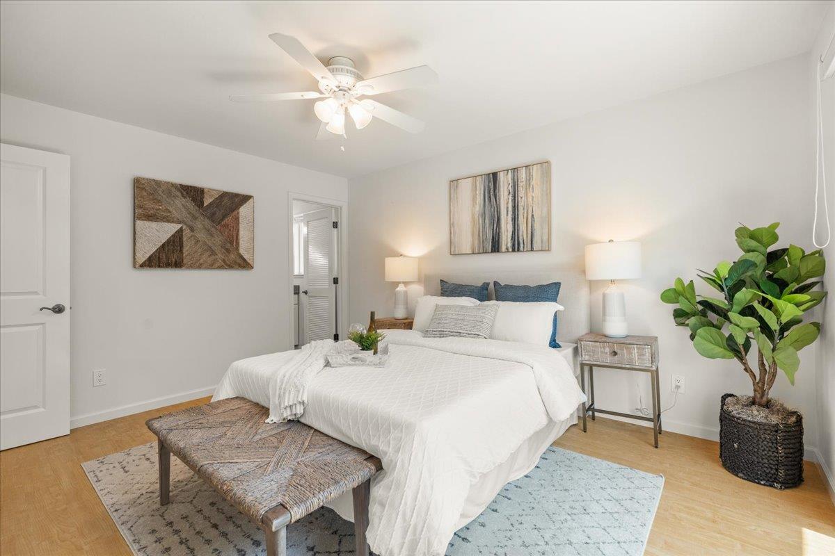 115 Hames Road Watsonville, CA 95076 - Photo 19 of 32 a bedroom with a bed and a potted plant