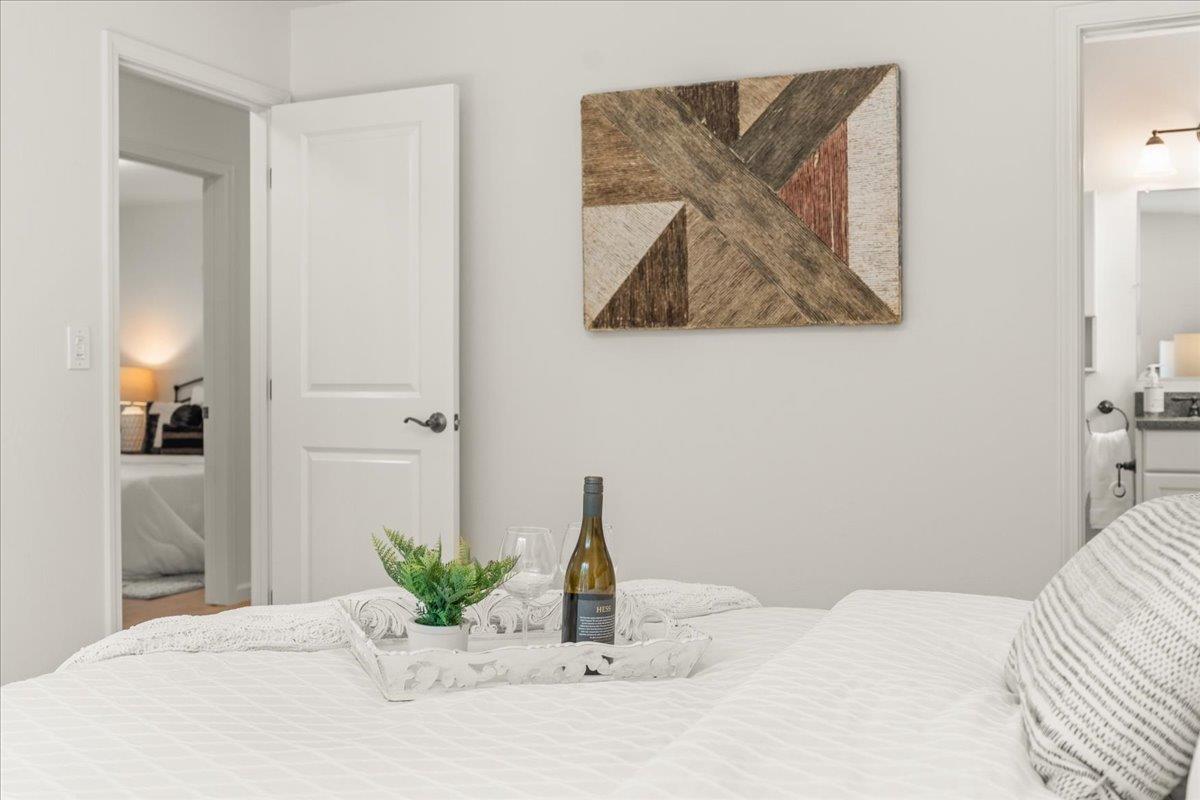 115 Hames Road Watsonville, CA 95076 - Photo 20 of 32 a bedroom with a bed and a potted plant