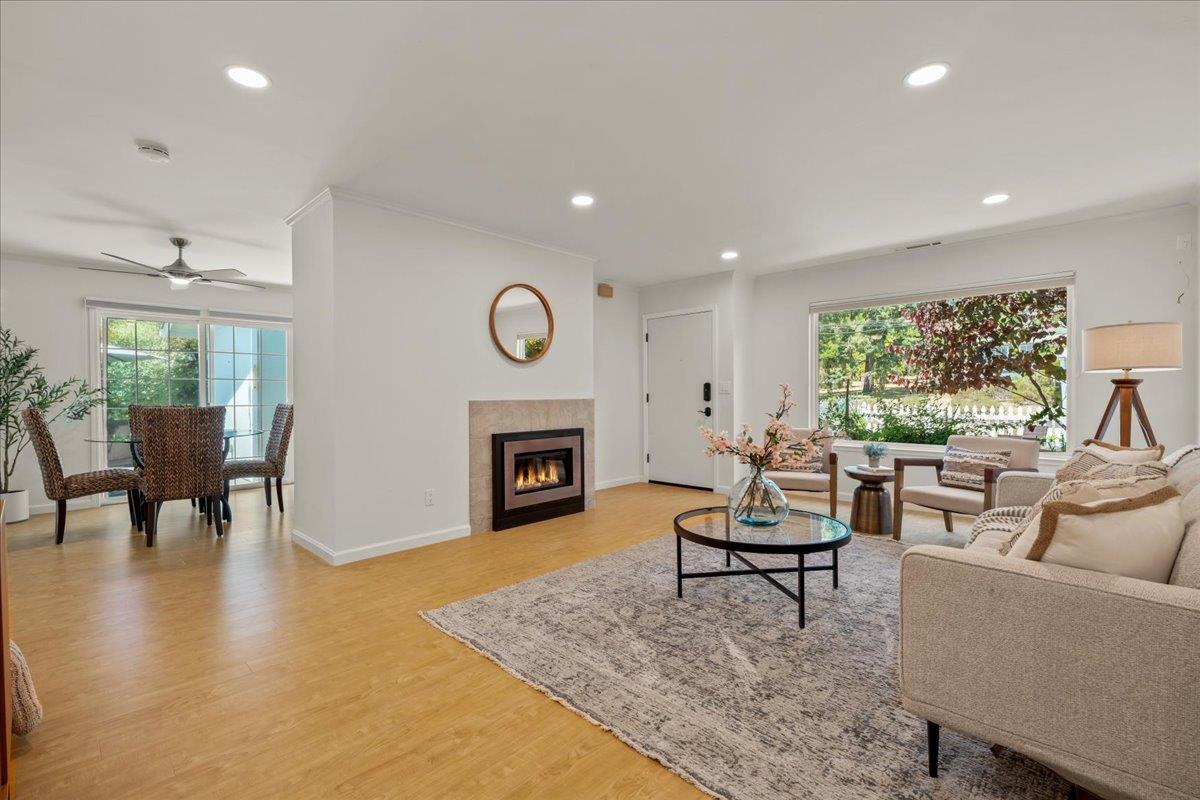 115 Hames Road Watsonville, CA 95076 - Photo 2 of 32 a living room with furniture a fireplace and a large window