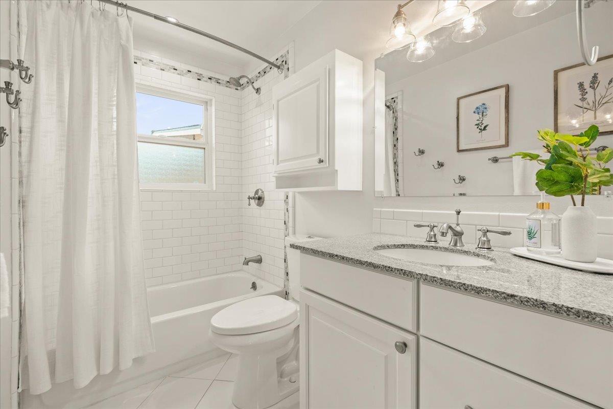 115 Hames Road Watsonville, CA 95076 - Photo 24 of 32 a bathroom with a granite countertop sink toilet and shower