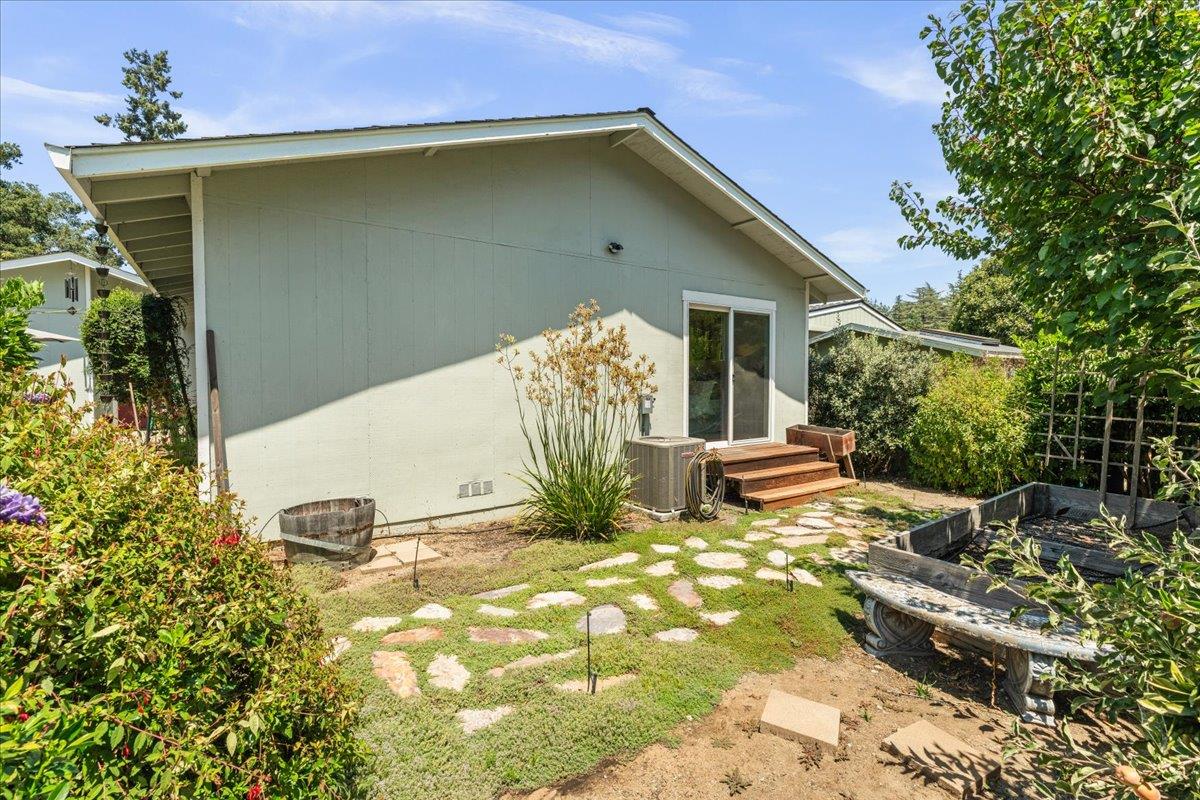 115 Hames Road Watsonville, CA 95076 - Photo 30 of 32 a view of a backyard with plants and patio