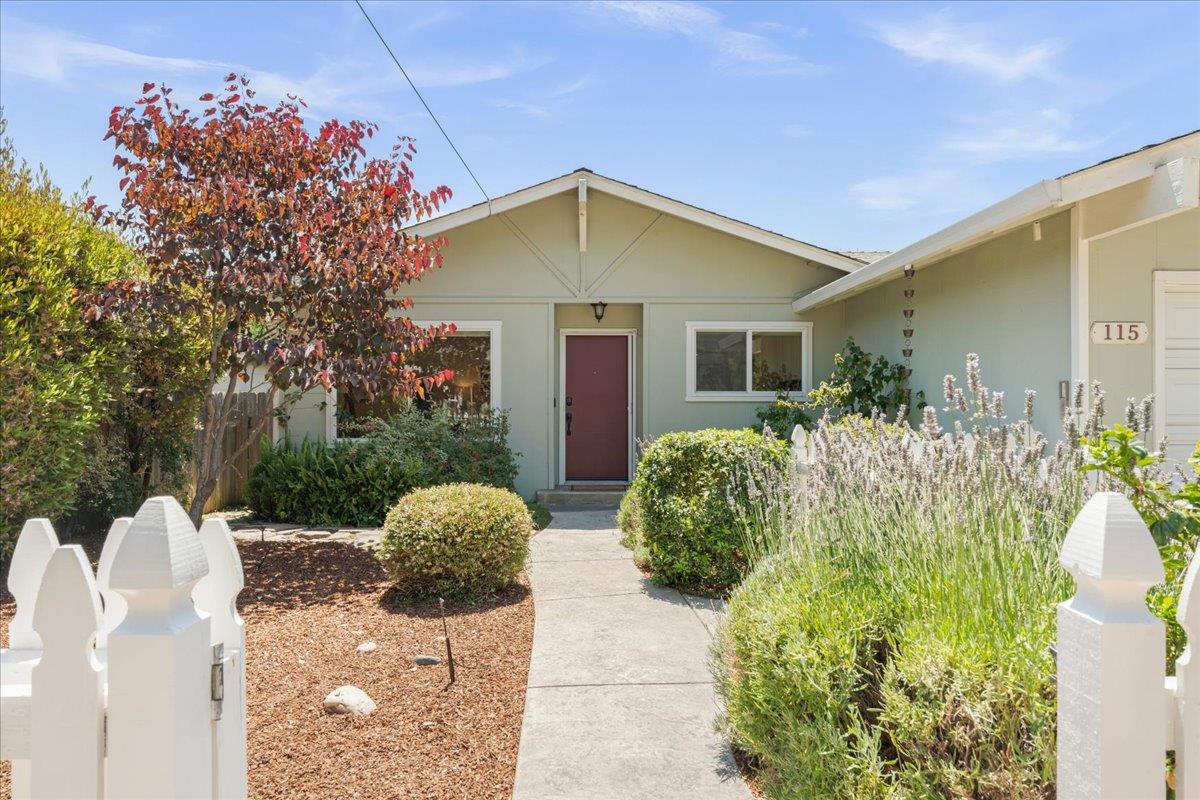 115 Hames Road Watsonville, CA 95076 - Photo 6 of 32 a front view of a house with a yard and potted plants