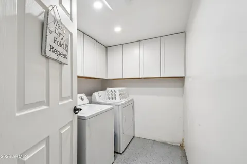 a bathroom with a sink mirror and toilet