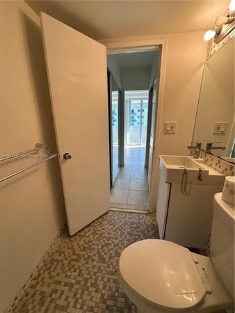 a bathroom with a sink and toilet