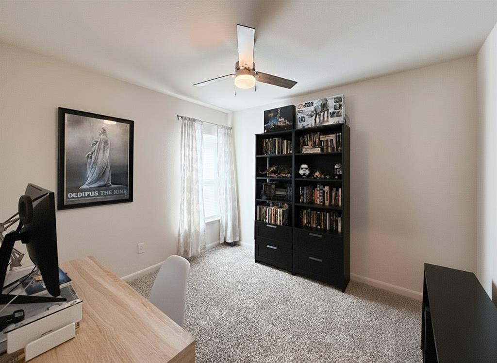 13507 Granite Park Road Ponder, TX 76259 - Photo 20 of 28 a living room with furniture and a flat screen tv