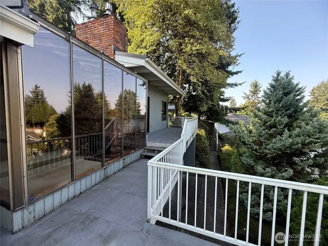 a kitchen with white cabinets and a stove