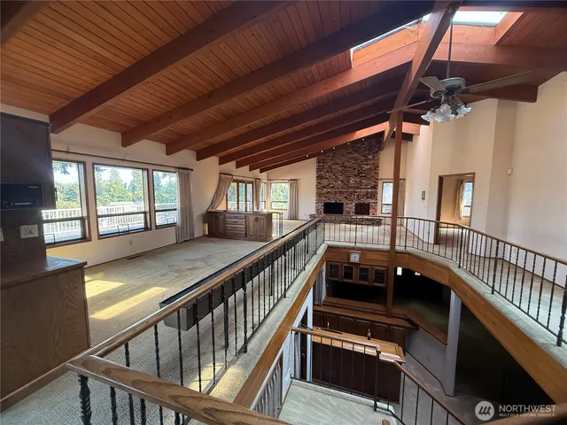 a kitchen with refrigerator and furniture