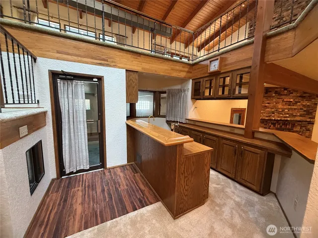 a bathroom with a tub sink and mirror