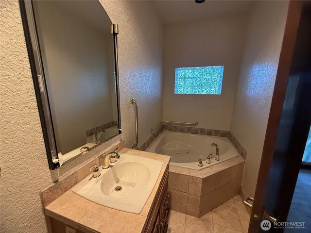 an empty room with closet and mirror