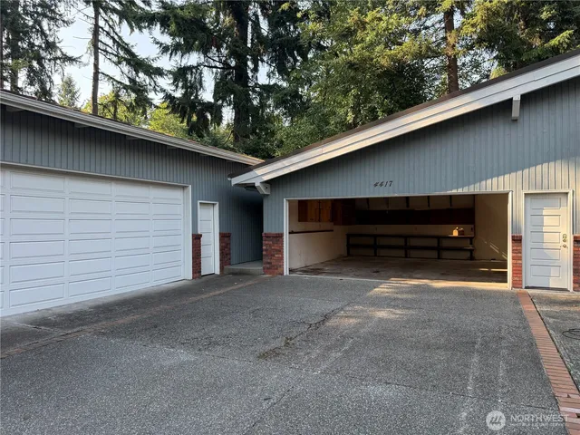 a view of backyard and garage