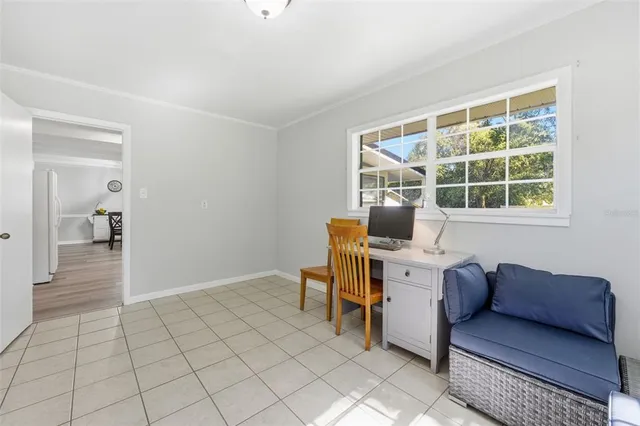 a work room with furniture and a window